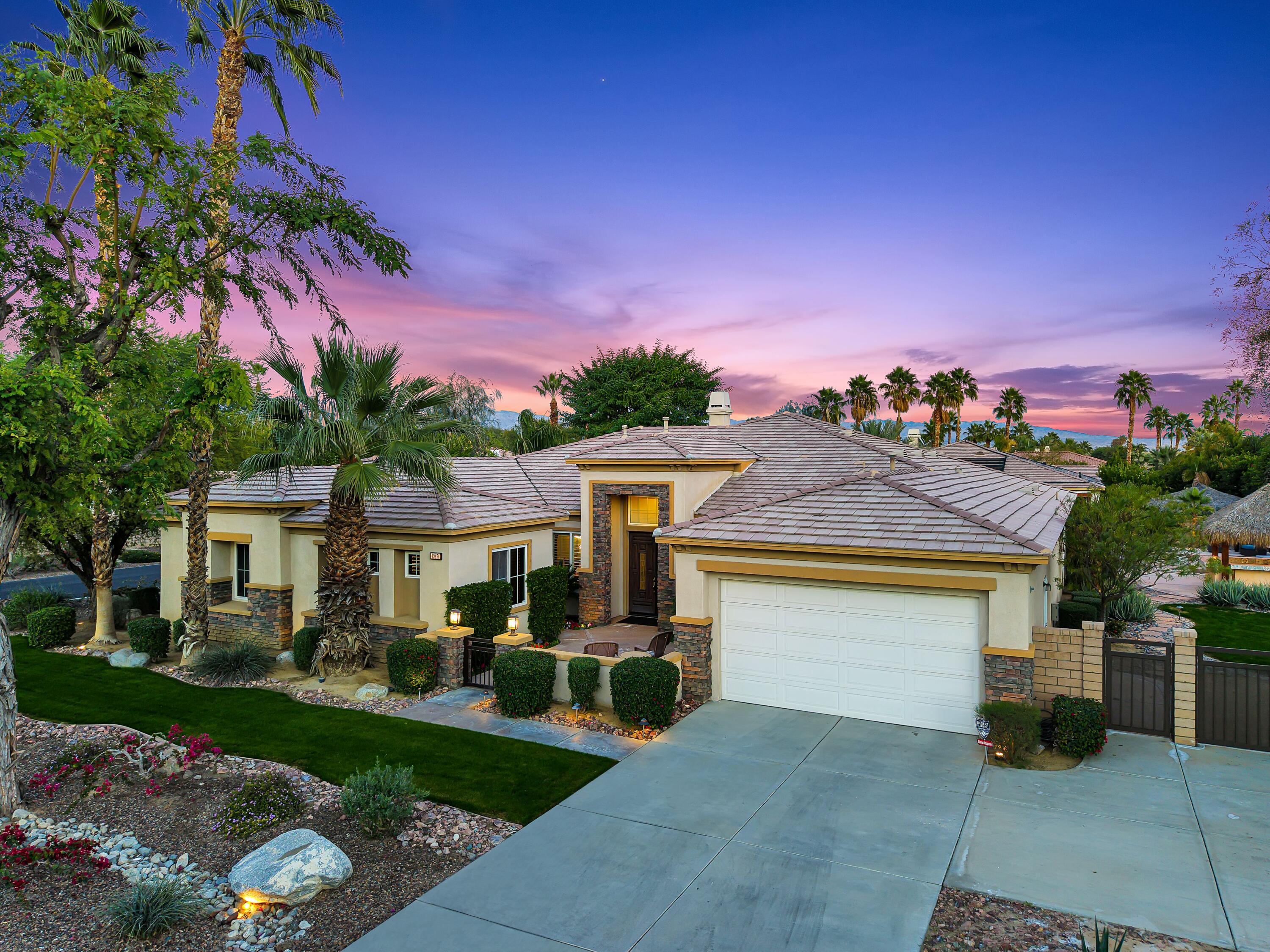 49474 Jordan Street Indio, CA 92201 - Photo 45 of 51 a front view of a house with a yard and a garage