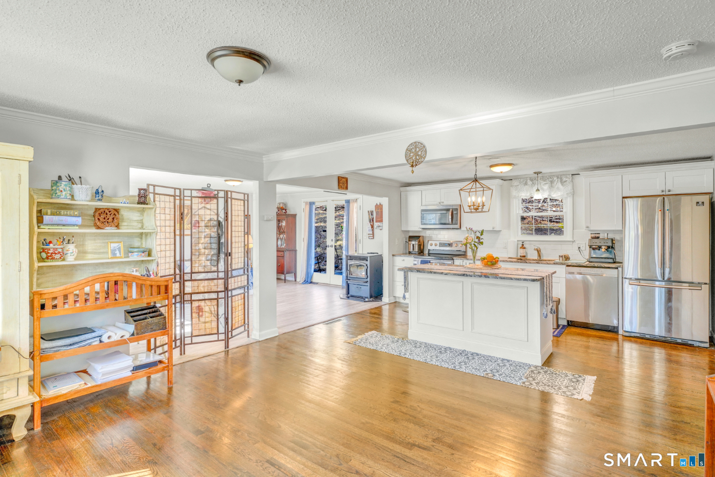 140 Devonwood Drive Waterbury, CT 06708 - Photo 2 of 13 a kitchen with stainless steel appliances wooden floor and large windows