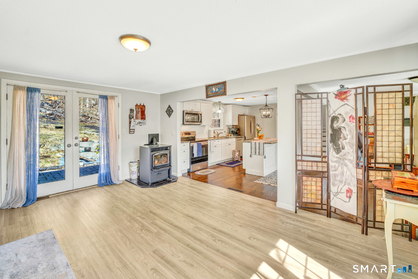 140 Devonwood Drive Waterbury, CT 06708 - Photo 7 of 13 a room with furniture and a flat screen tv