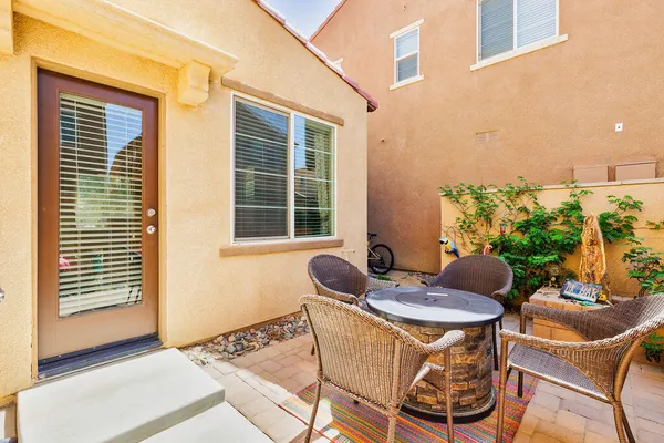 a table and chairs in a patio