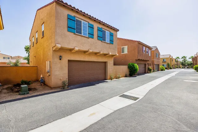 a front view of a house with a garage