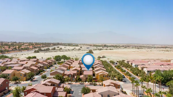 an aerial view of a house with a ocean view