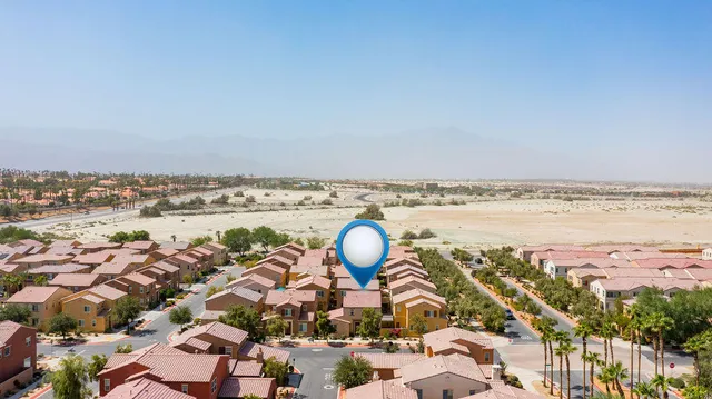 an aerial view of a house with a ocean view