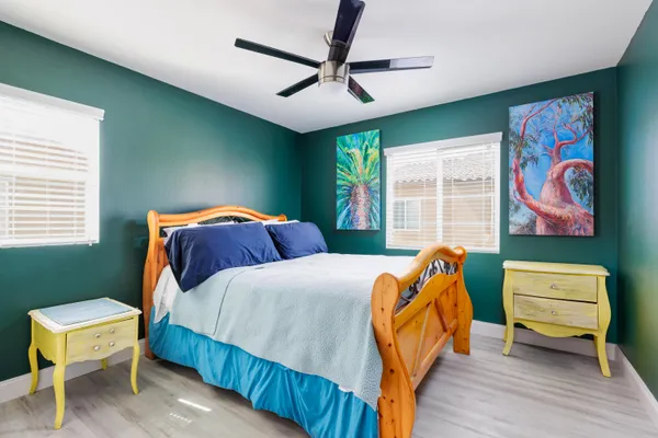 a bedroom with bed and a window