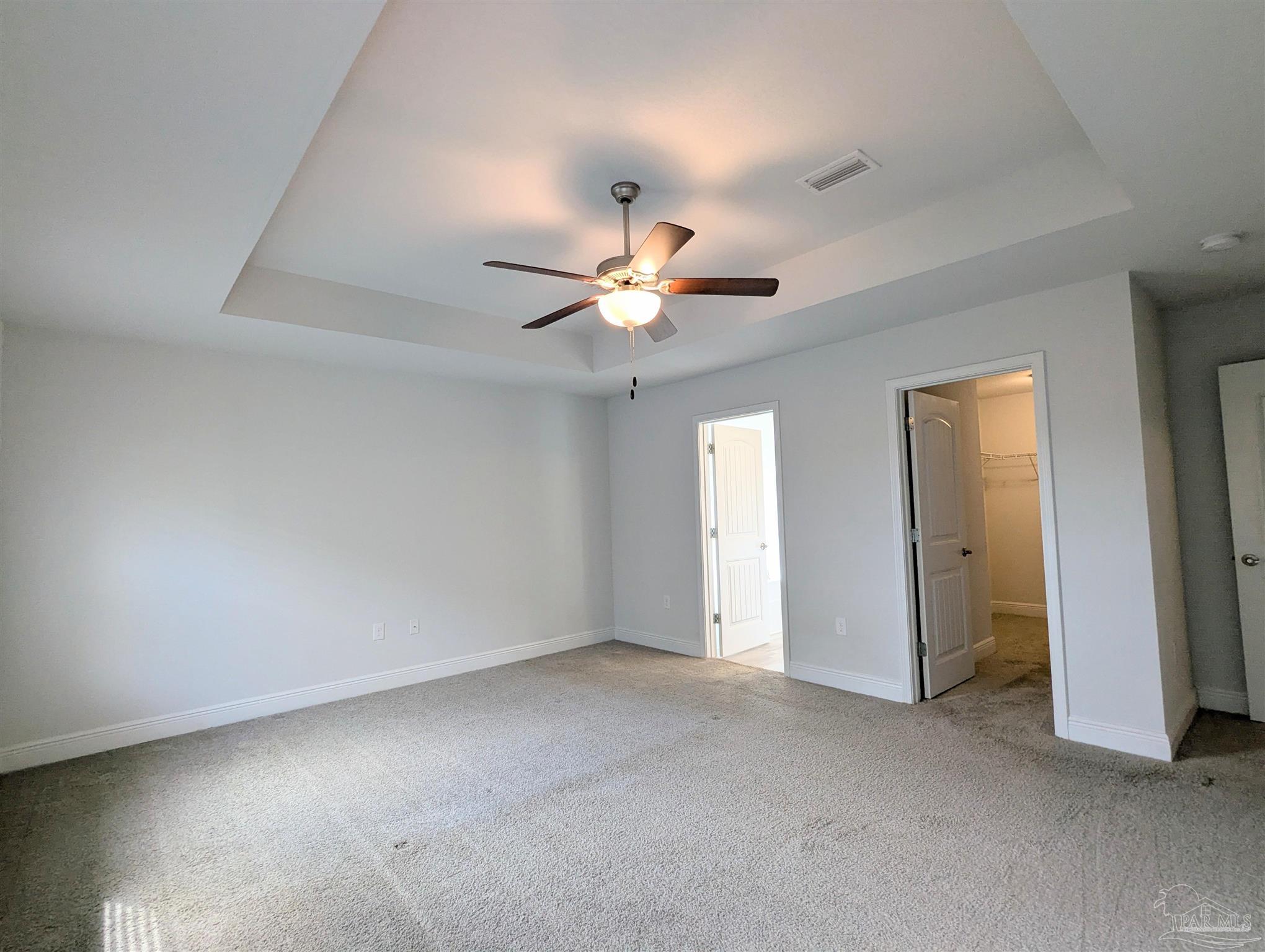 4723 Frances Street Pace, FL 32571 - Photo 11 of 41 an empty room with a ceiling fan and a window