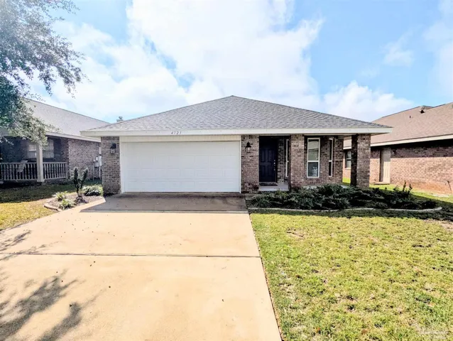 a front view of a house with yard