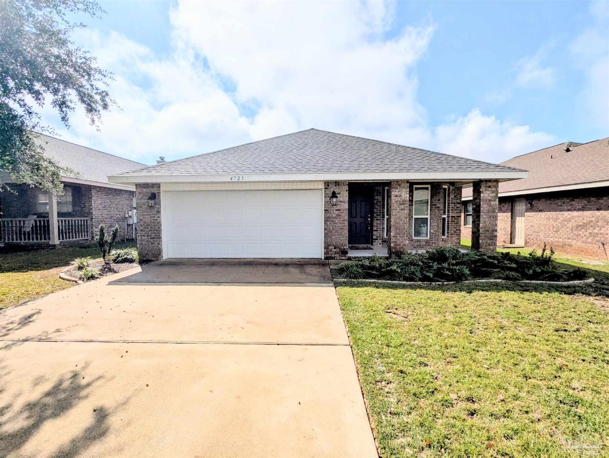 4723 Frances Street Pace, FL 32571 - Photo 2 of 41 a front view of a house with yard
