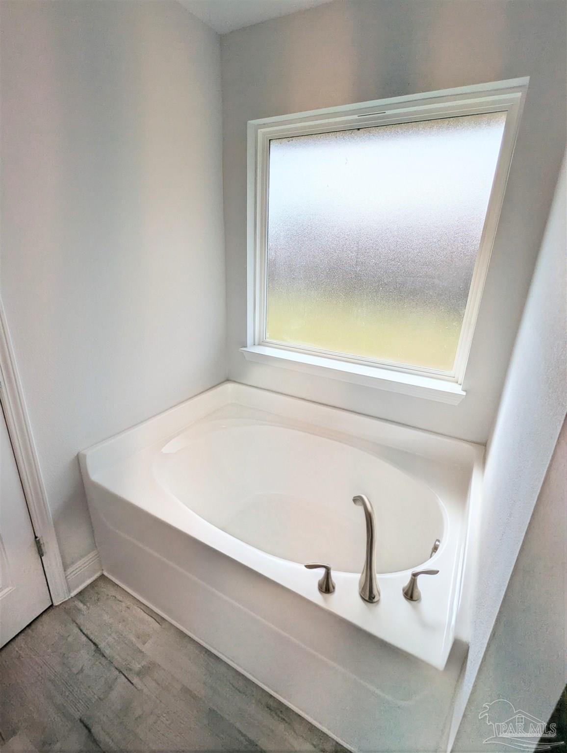 4723 Frances Street Pace, FL 32571 - Photo 22 of 41 a bathroom with a bathtub