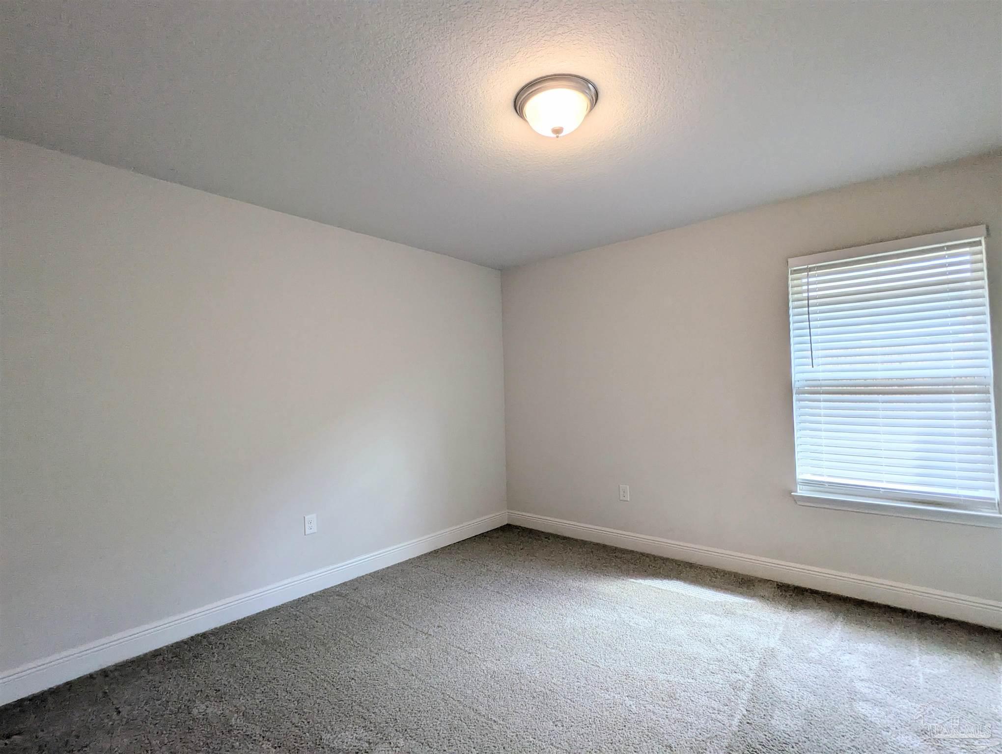 4723 Frances Street Pace, FL 32571 - Photo 27 of 41 an empty room with a window