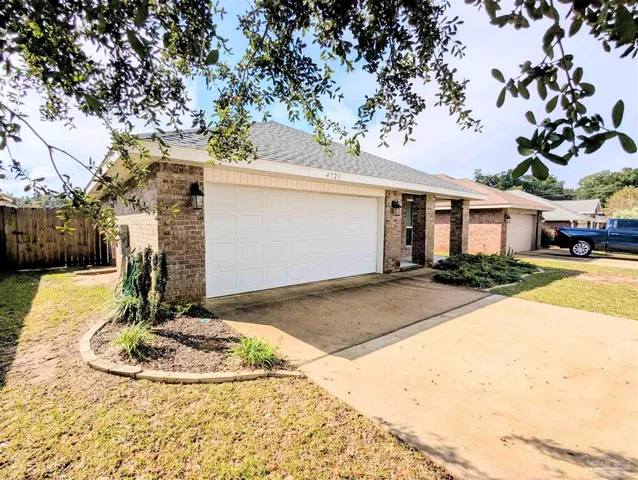 a view of a house with basketball court