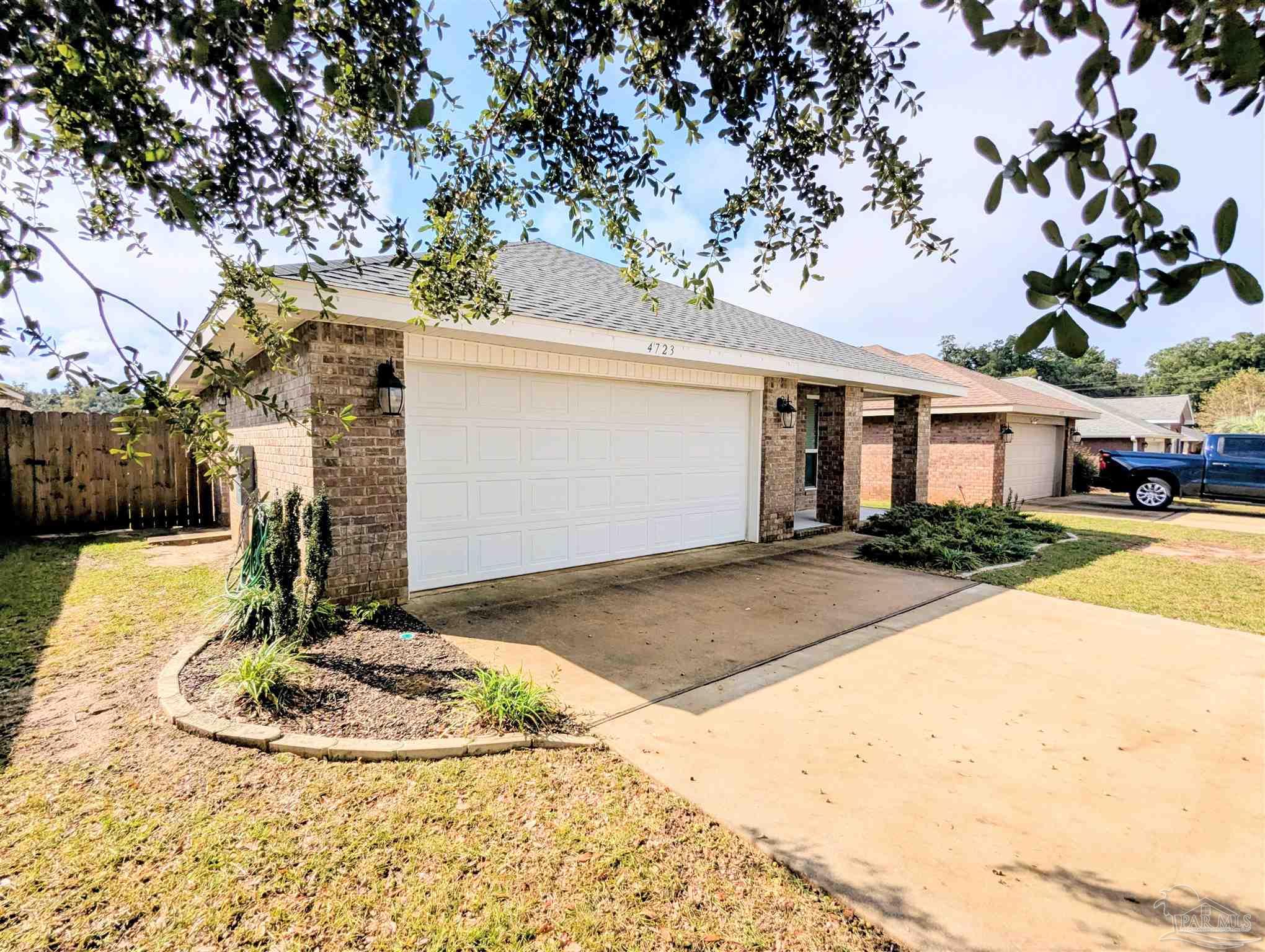 4723 Frances Street Pace, FL 32571 - Photo 3 of 41 a view of a house with basketball court