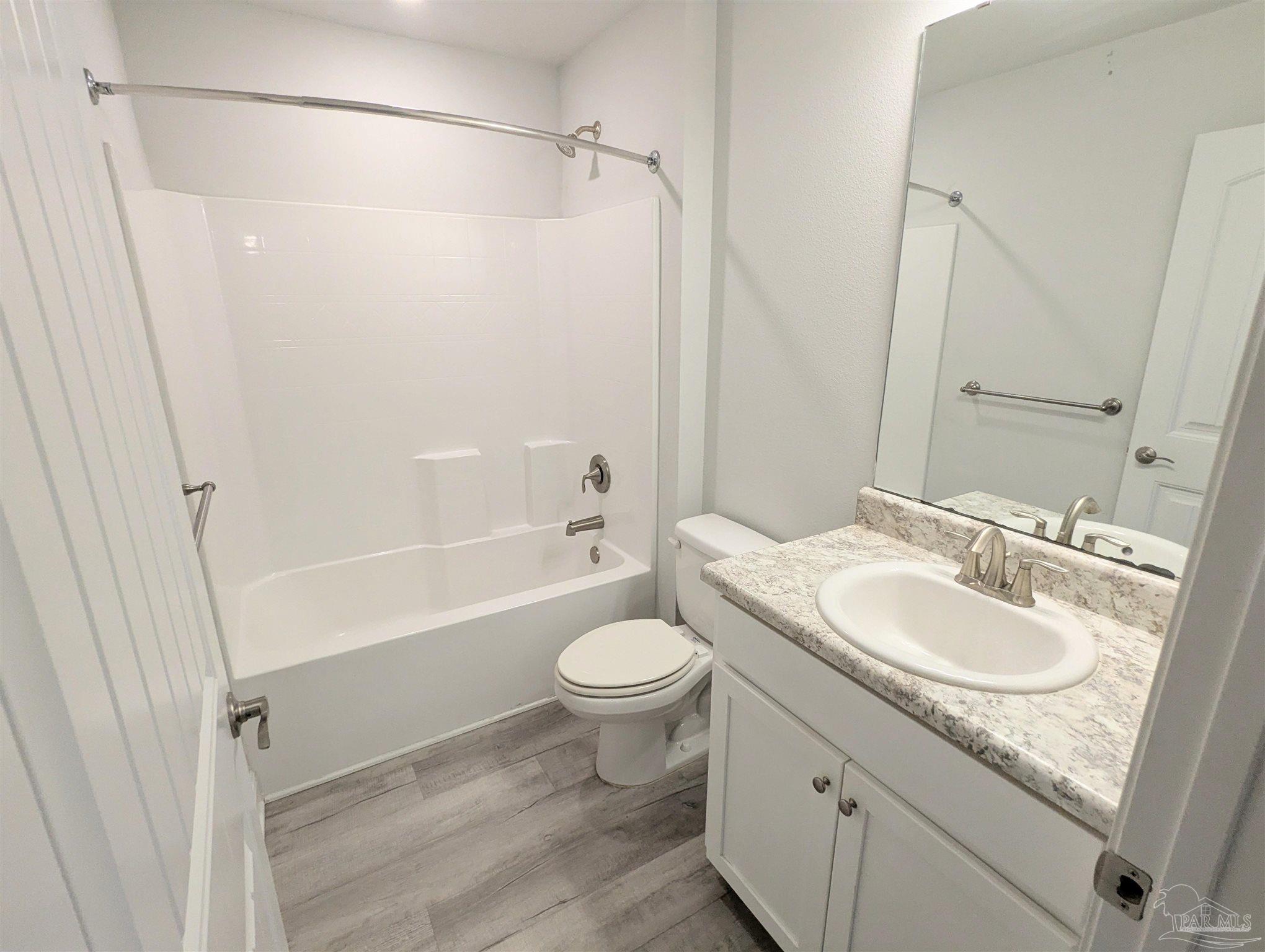 4723 Frances Street Pace, FL 32571 - Photo 31 of 41 a bathroom with a sink a toilet and shower