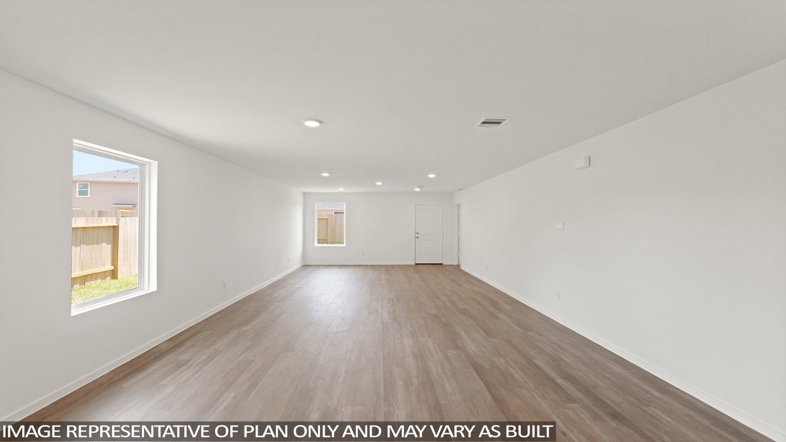965 Sutherland Falls Street Conroe, TX 77303 - Photo 13 of 35 a view of an empty room with wooden floor and a window