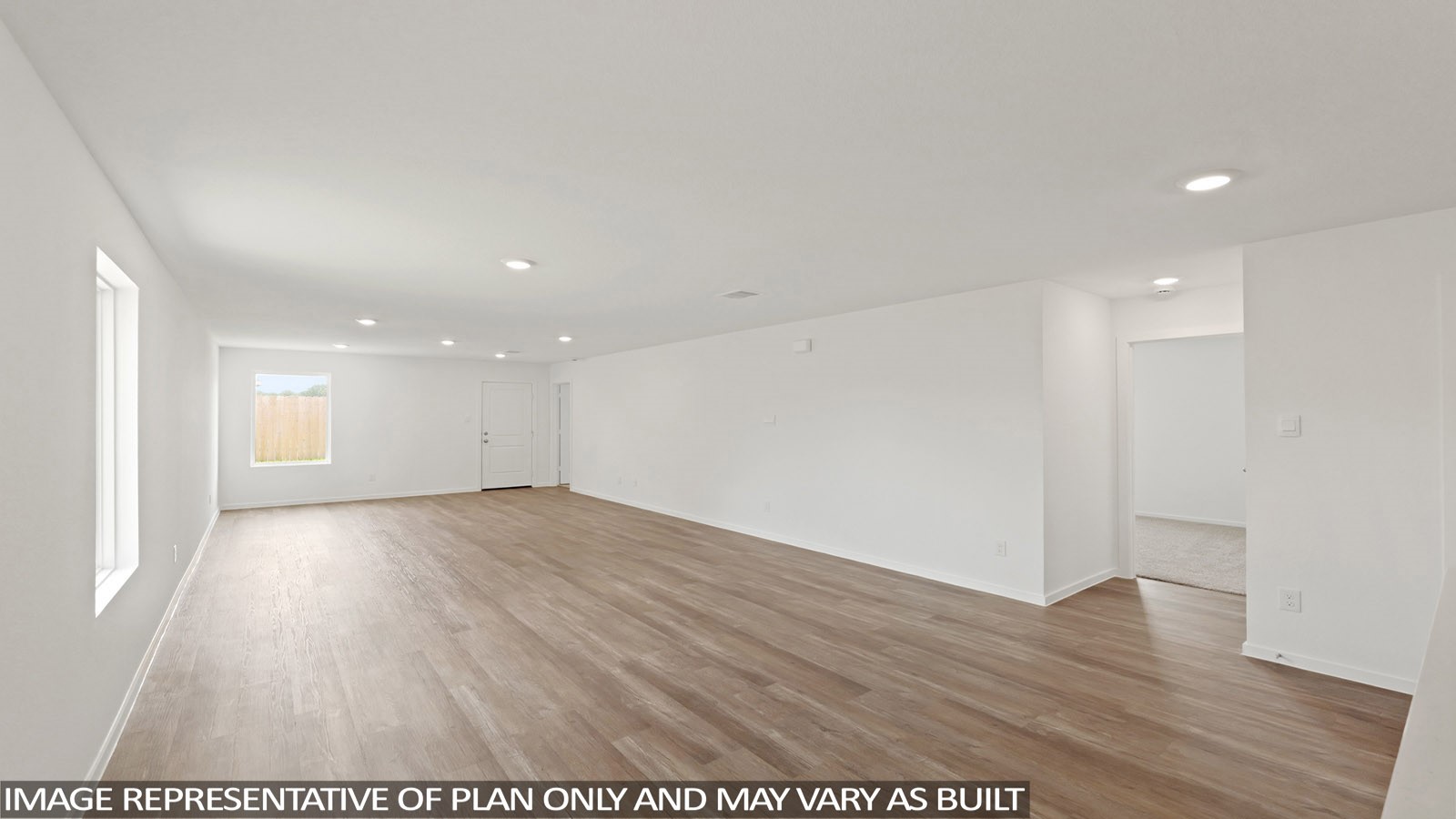 965 Sutherland Falls Street Conroe, TX 77303 - Photo 14 of 35 a view of an empty room with wooden floor