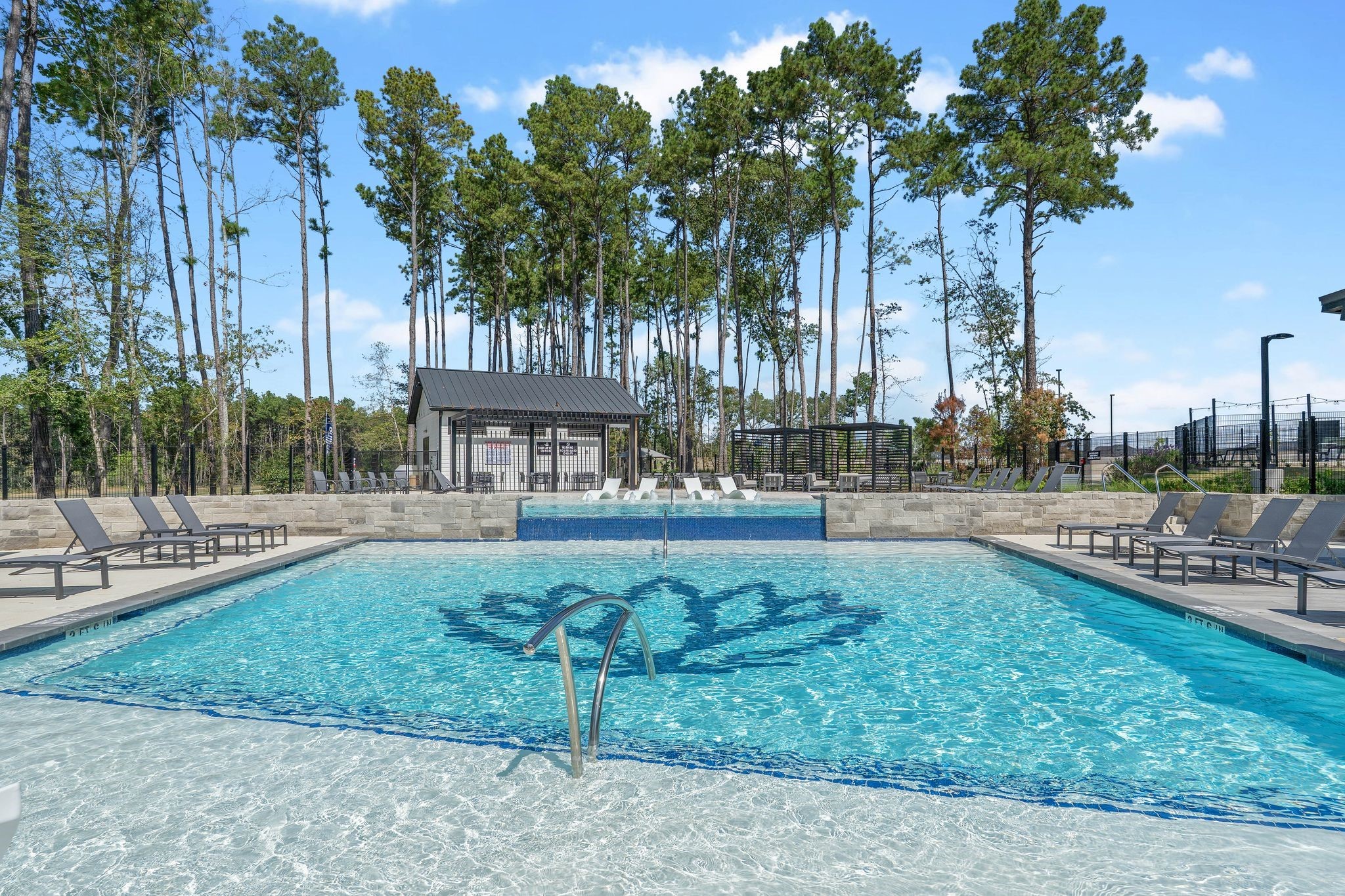 965 Sutherland Falls Street Conroe, TX 77303 - Photo 28 of 35 a view of a yard with fountain and large trees