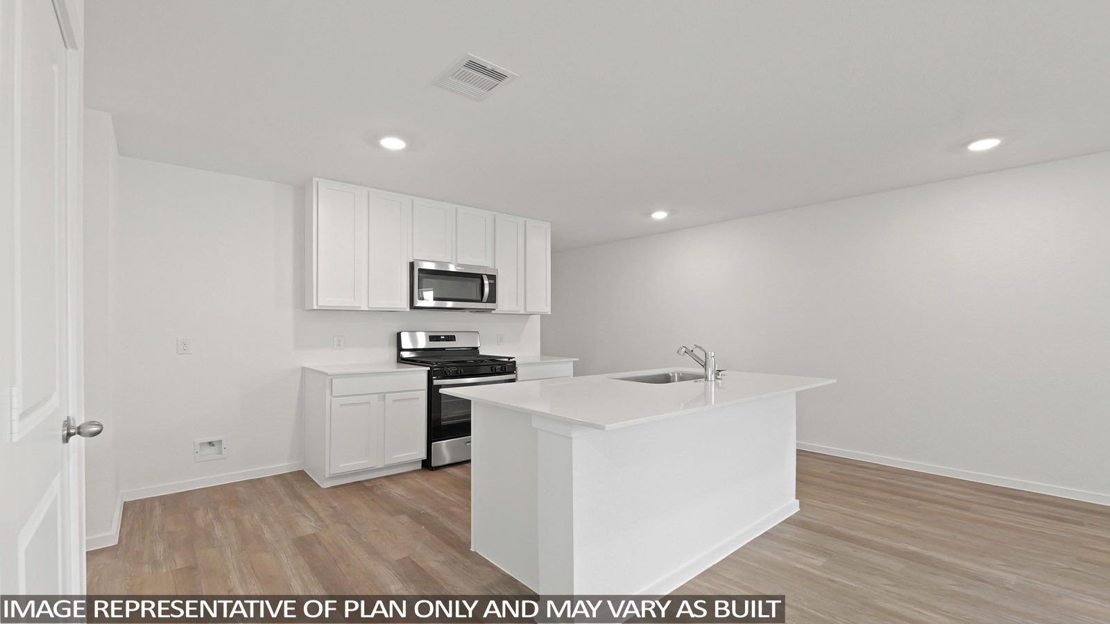 965 Sutherland Falls Street Conroe, TX 77303 - Photo 4 of 35 a kitchen with stainless steel appliances a sink stove and refrigerator