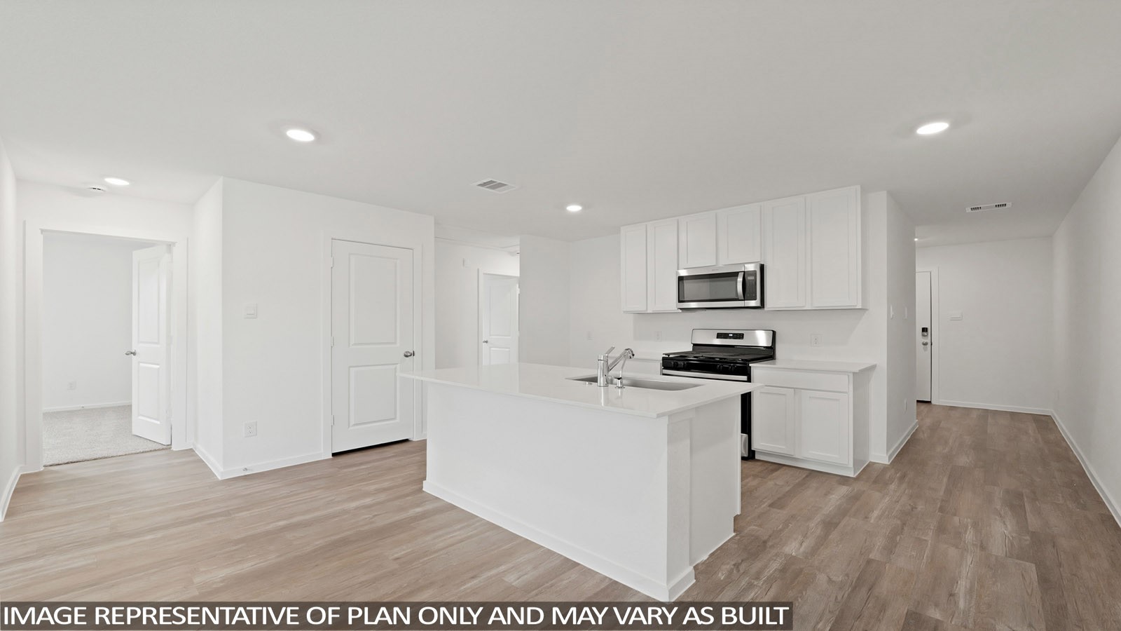 965 Sutherland Falls Street Conroe, TX 77303 - Photo 5 of 35 a kitchen with stainless steel appliances a stove a refrigerator a sink a microwave with wooden floor and cabinets