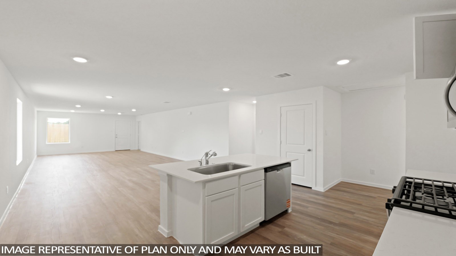 965 Sutherland Falls Street Conroe, TX 77303 - Photo 8 of 35 a view of a kitchen with kitchen island a sink wooden floor and glass doors
