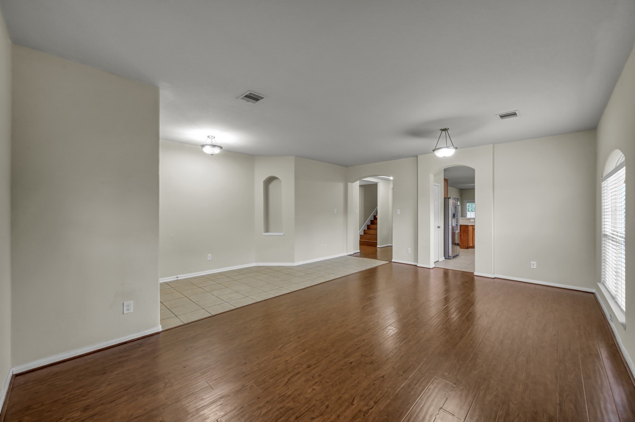 631 Timberstand Lane Spring, TX 77373 - Photo 8 of 38 The spacious den features upgraded laminate flooring and plenty of natural light with endless possibilities to fit your needs.