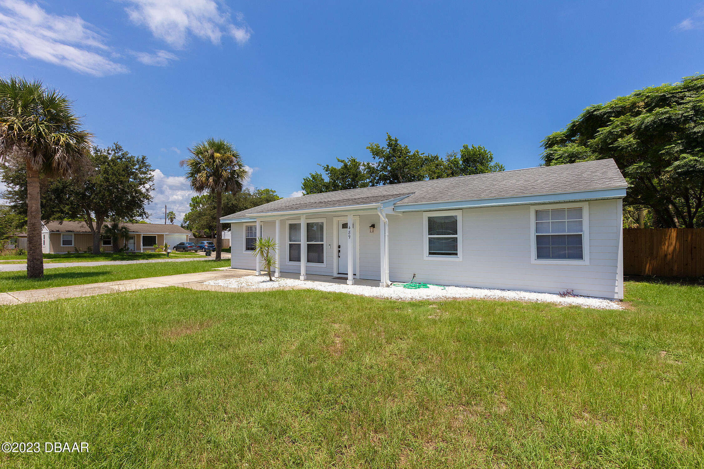 489 Wiltshire Boulevard Port Orange, FL 32127 - Photo 2 of 40 a front view of house with yard and green space