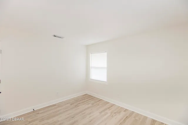 a view of an empty room and window