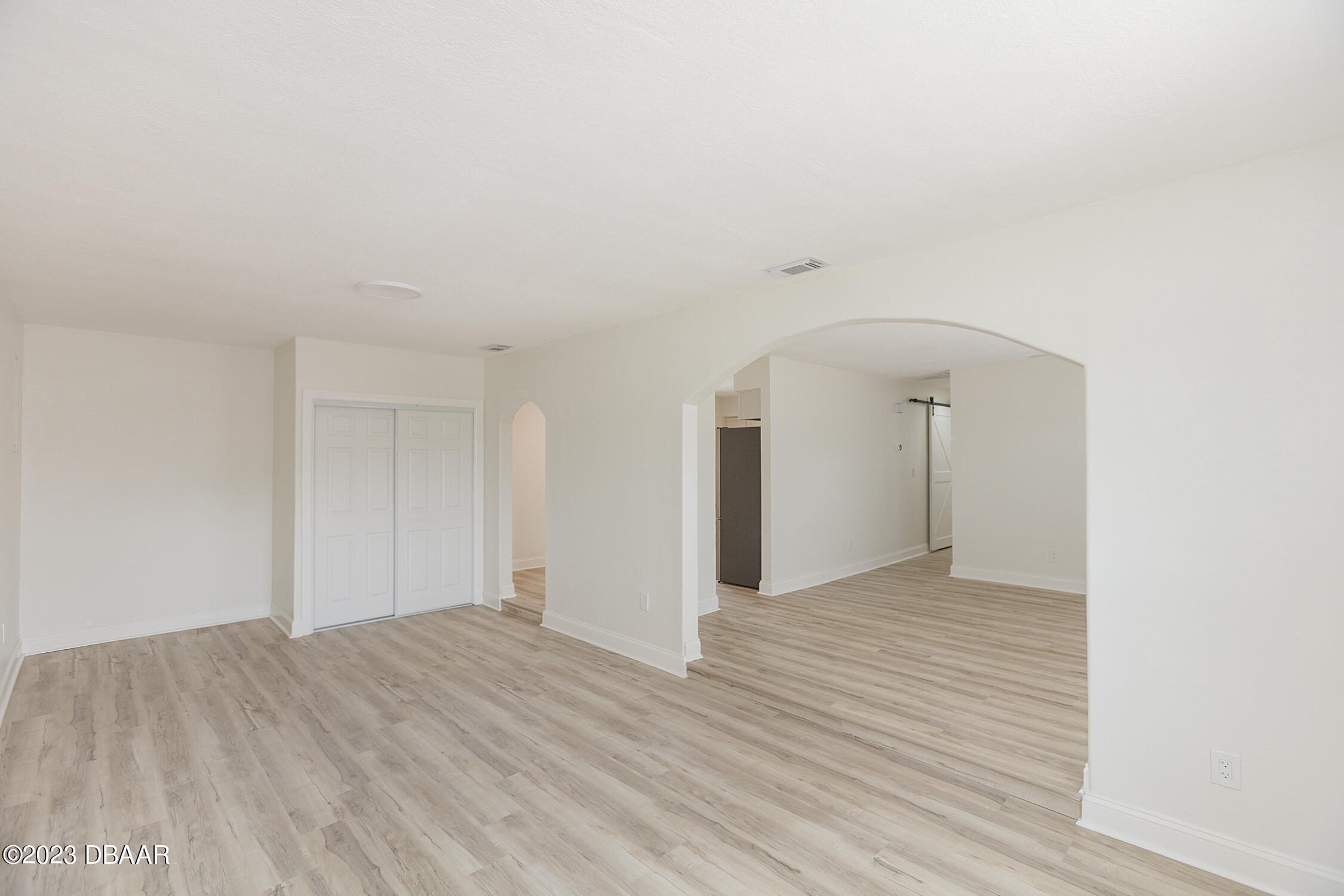 489 Wiltshire Boulevard Port Orange, FL 32127 - Photo 40 of 40 a view of empty room with wooden floor