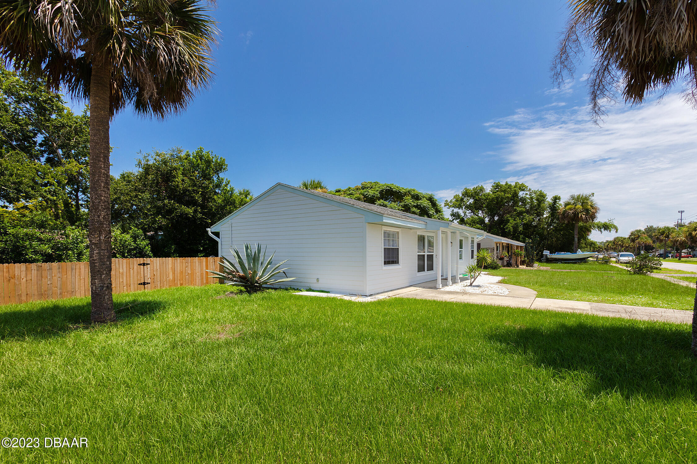 489 Wiltshire Boulevard Port Orange, FL 32127 - Photo 4 of 40 a view of a house with a backyard