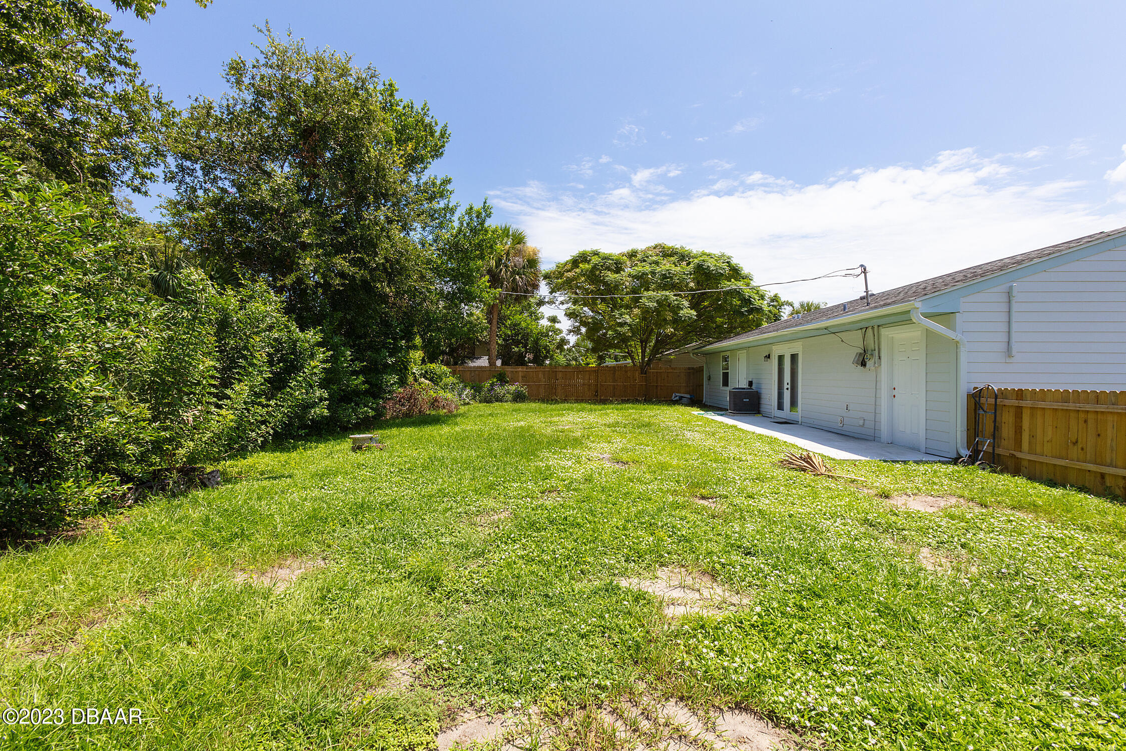 489 Wiltshire Boulevard Port Orange, FL 32127 - Photo 6 of 40 a view of backyard with trampoline