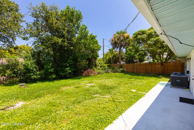 a view of yard with swimming pool