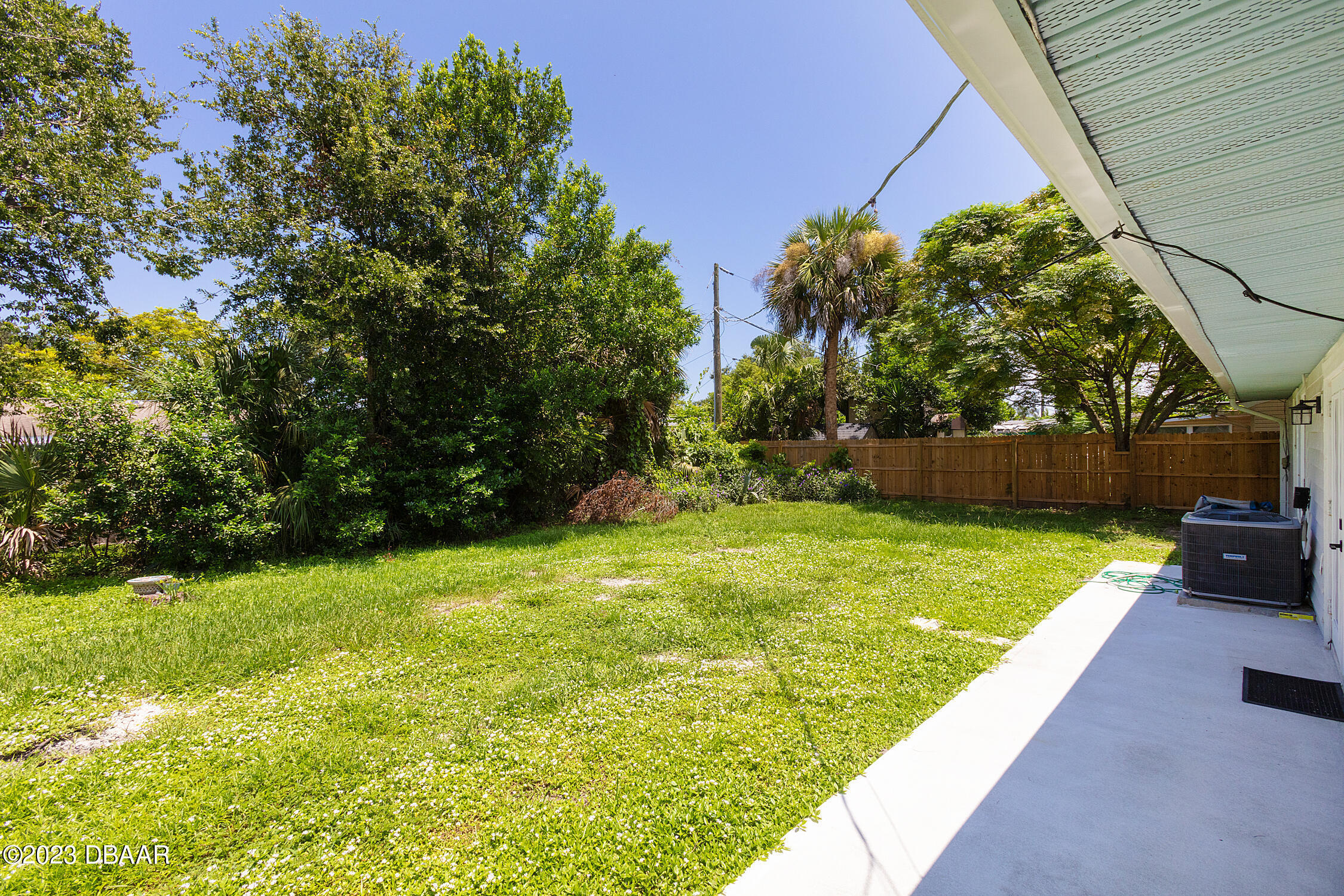 489 Wiltshire Boulevard Port Orange, FL 32127 - Photo 8 of 40 a view of yard with swimming pool