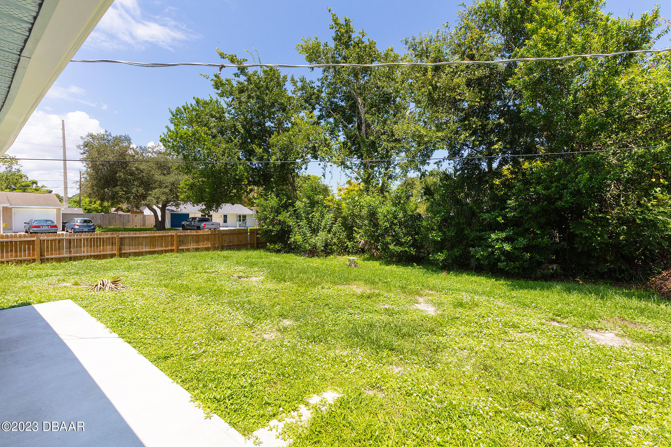 489 Wiltshire Boulevard Port Orange, FL 32127 - Photo 9 of 40 a view of yard with swimming pool outdoor seating and green space