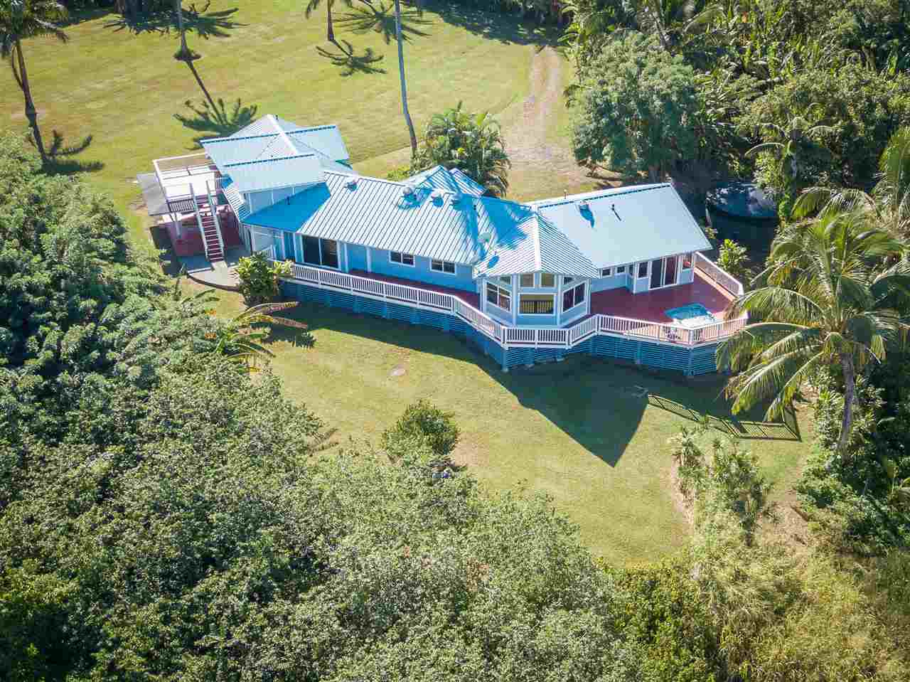65 Door Of Faith Road Haiku, HI 96708 - Photo 1 of 30 a aerial view of a house with swimming pool