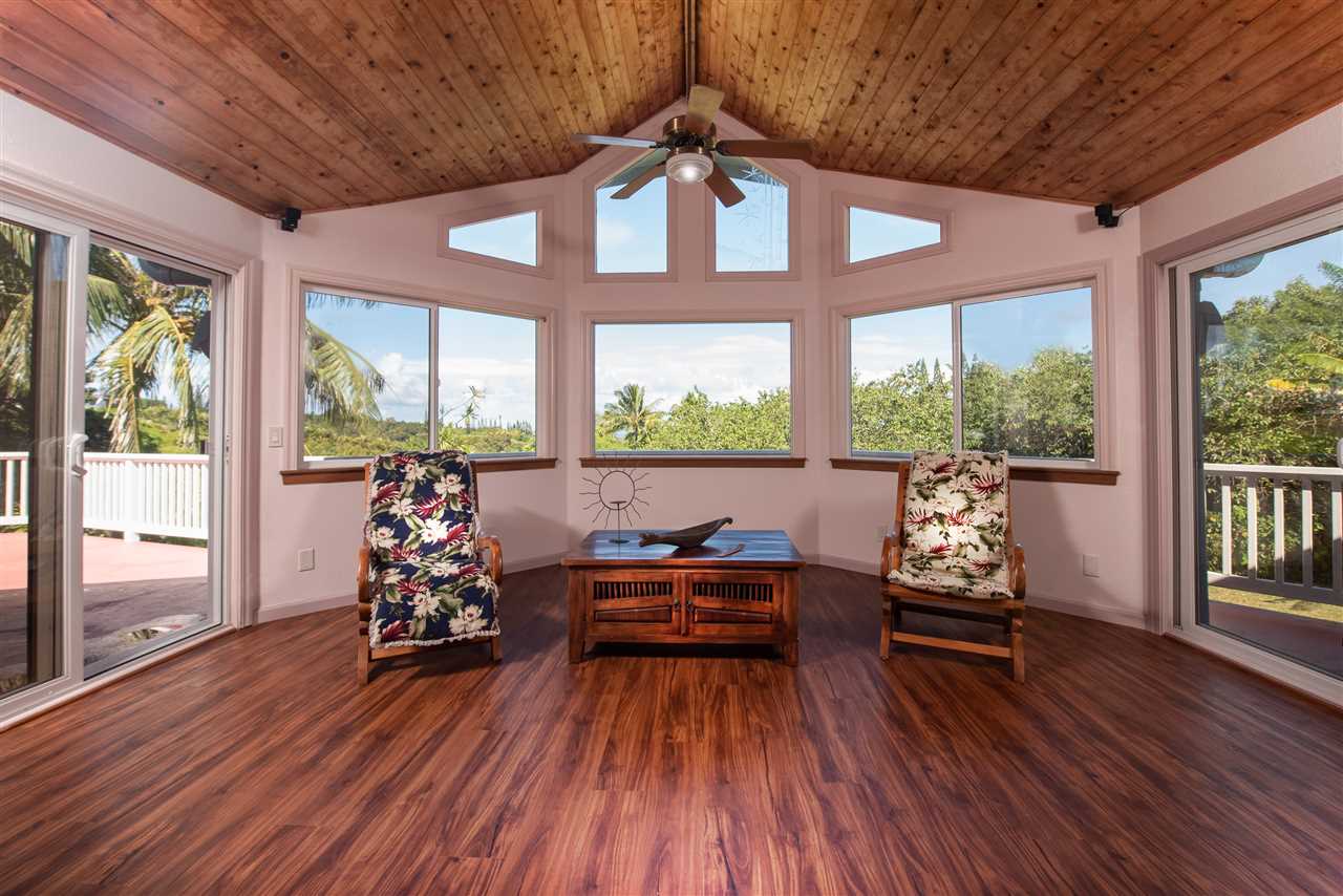 65 Door Of Faith Road Haiku, HI 96708 - Photo 2 of 30 a living room with furniture and wooden floor