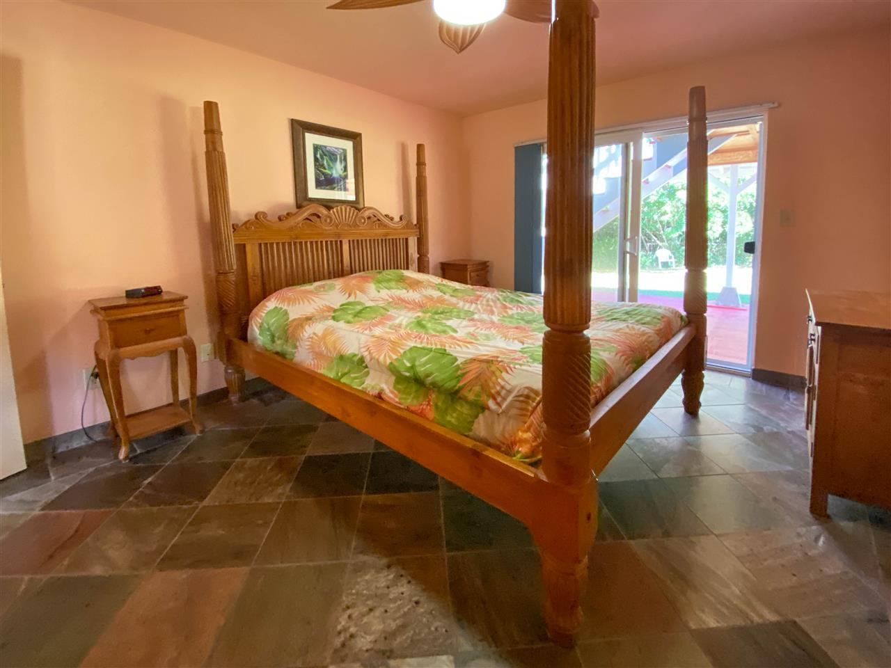 65 Door Of Faith Road Haiku, HI 96708 - Photo 21 of 30 a bed sitting in a bedroom next to a window
