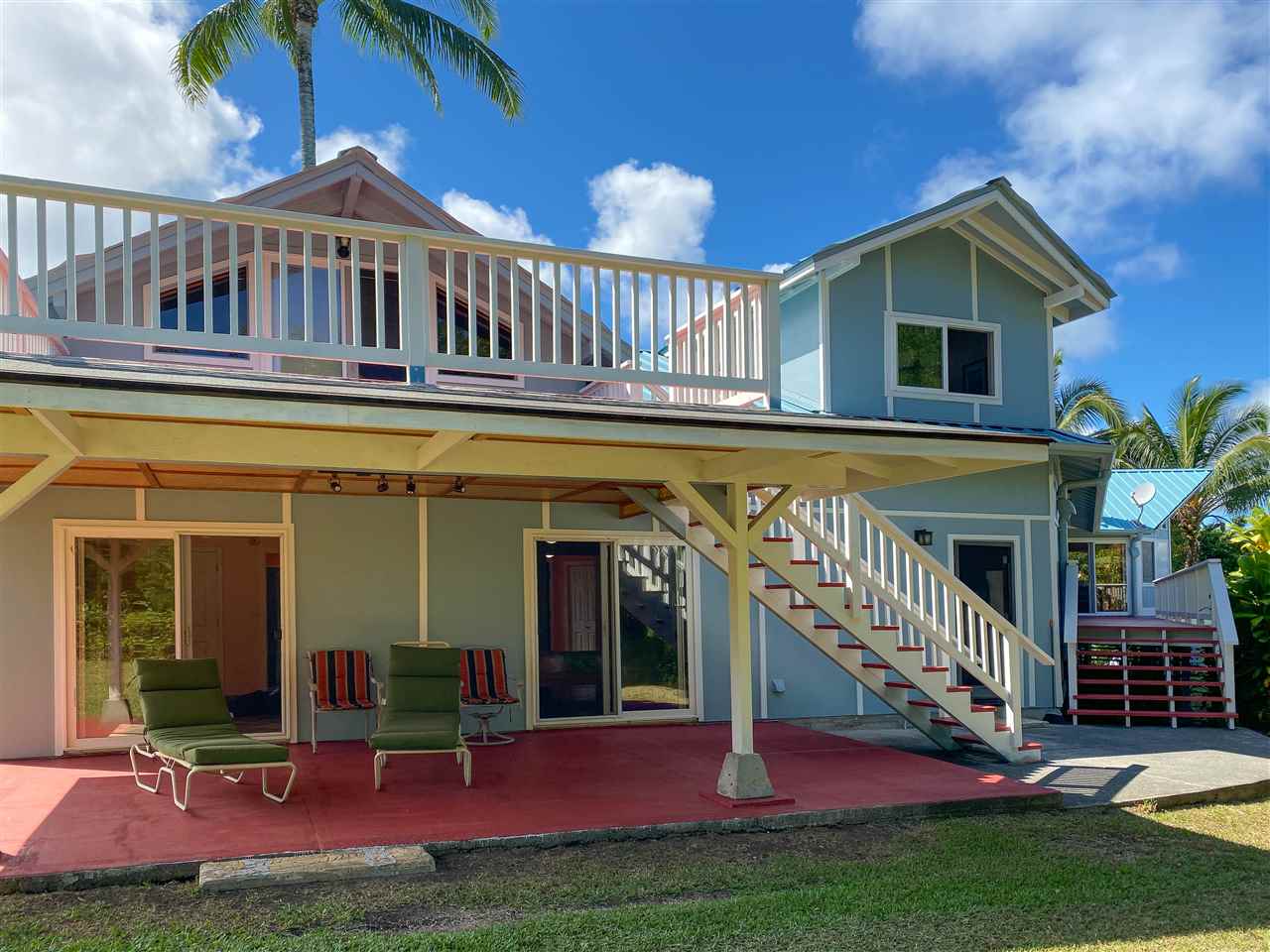 65 Door Of Faith Road Haiku, HI 96708 - Photo 27 of 30 a view of a house with a yard and deck