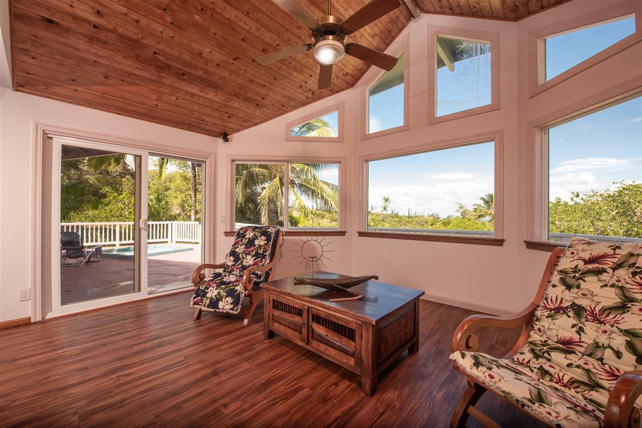 65 Door Of Faith Road Haiku, HI 96708 - Photo 3 of 30 a living room with furniture and wooden floor