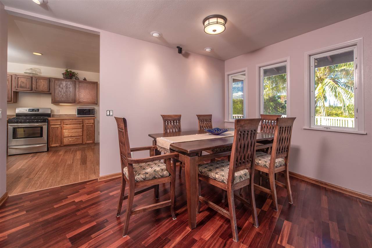 65 Door Of Faith Road Haiku, HI 96708 - Photo 5 of 30 a view of a dining room with furniture window and wooden floor