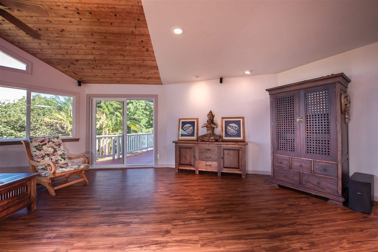 65 Door Of Faith Road Haiku, HI 96708 - Photo 6 of 30 a living room with furniture and wooden floor
