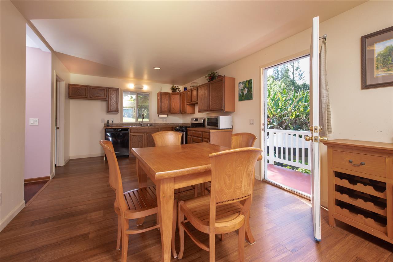 65 Door Of Faith Road Haiku, HI 96708 - Photo 8 of 30 a dining room with furniture a window and wooden floor