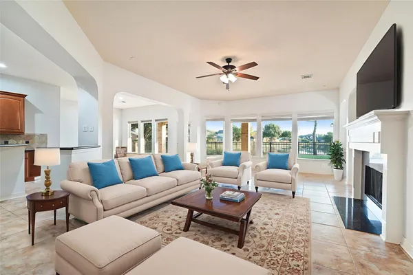 a living room with furniture fireplace and a flat screen tv