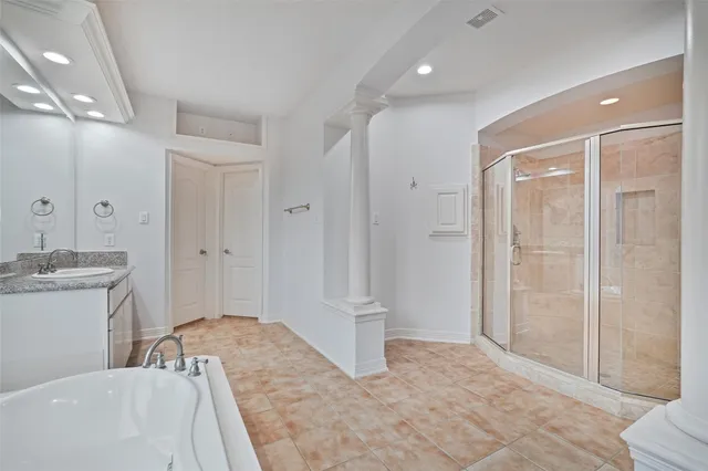 a spacious bathroom with a bathtub shower sink and toilet