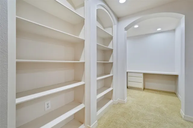 a view of an empty walk in closet