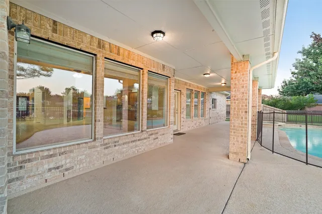 a view of a house with swimming pool