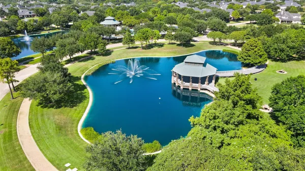 an aerial view of a swimming pool patio outdoor seating and yard