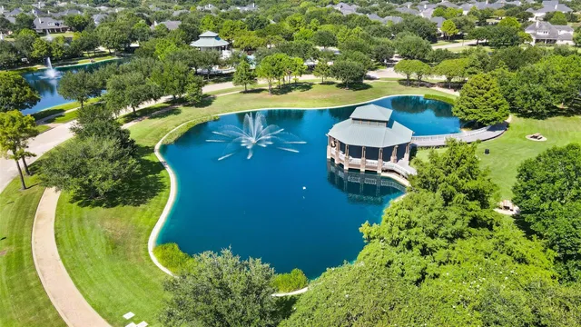 an aerial view of a swimming pool patio outdoor seating and yard