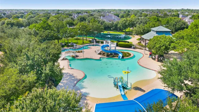 a view of a swimming pool with a patio