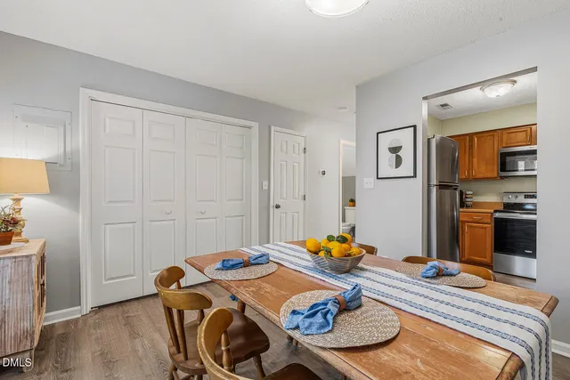 a bedroom with bed and a view of kitchen