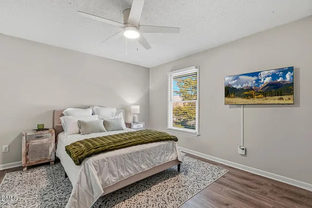 a bedroom with a large bed and a window