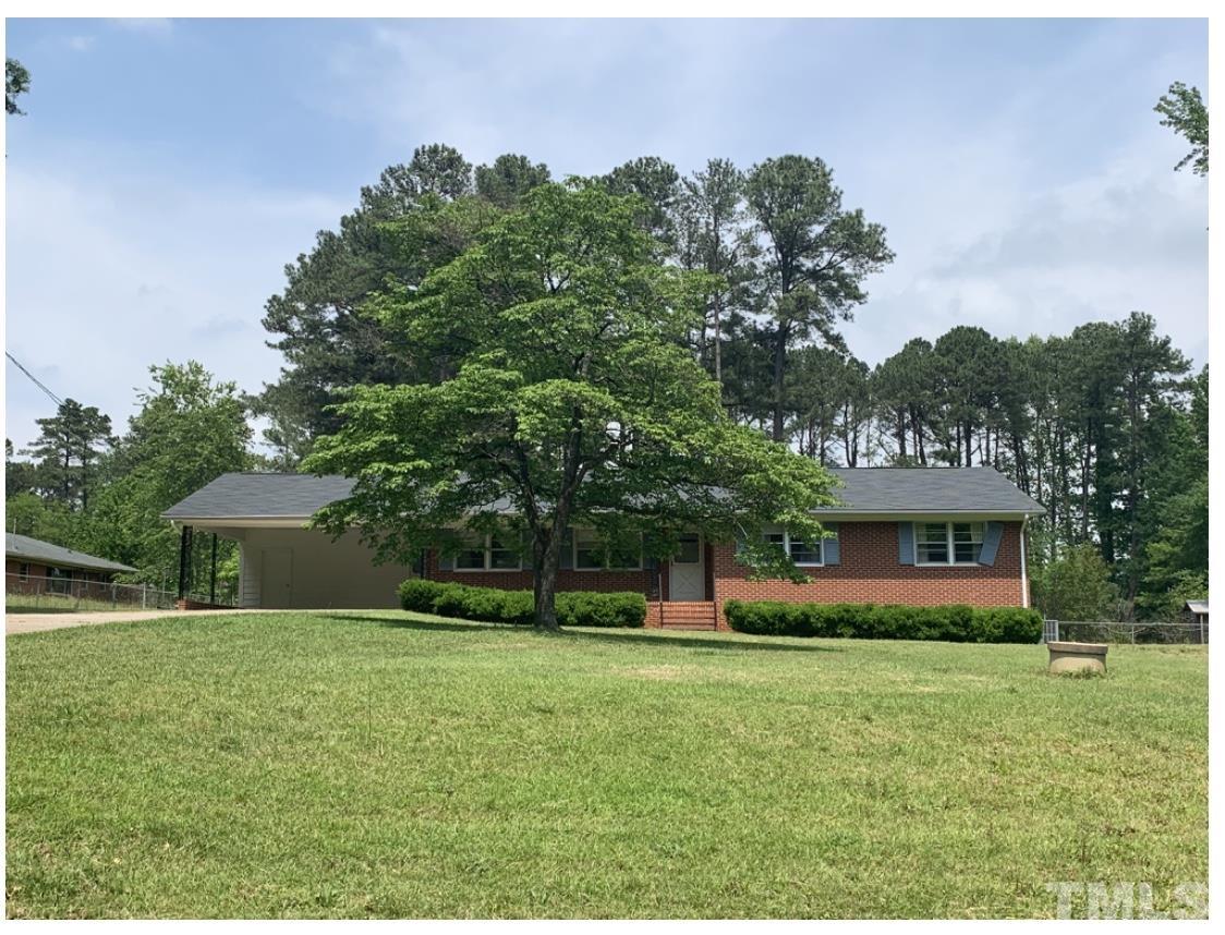 7600 Litchford Road Raleigh, NC 27615 - Photo 1 of 3 a front view of house with yard and green space