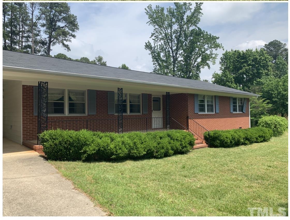 7600 Litchford Road Raleigh, NC 27615 - Photo 2 of 3 a view of a house with a garden